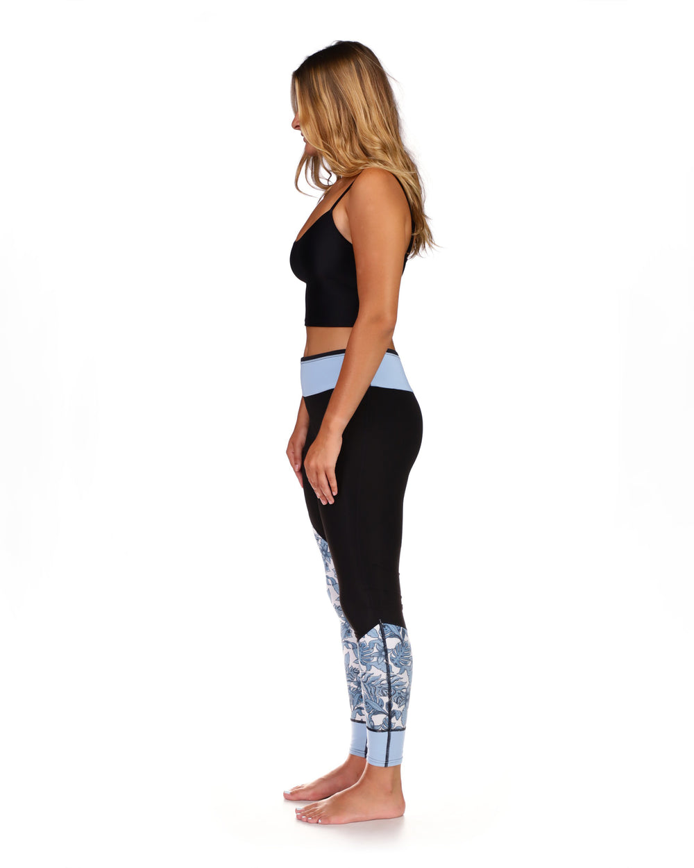 Body Glove Stellar women's black wetsuit pants with blue floral ankle print