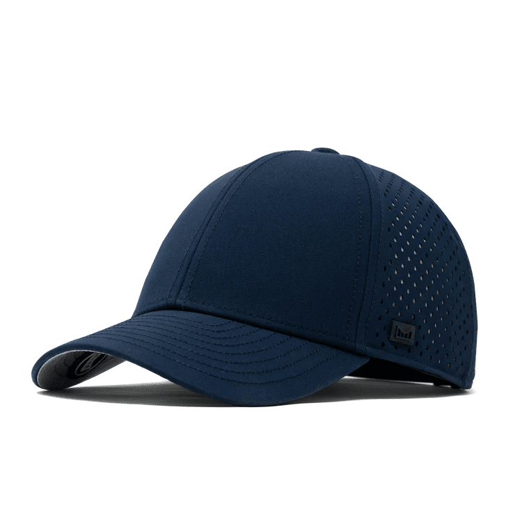 Melin navy blue perforated baseball cap with structured brim and rubber logo patch