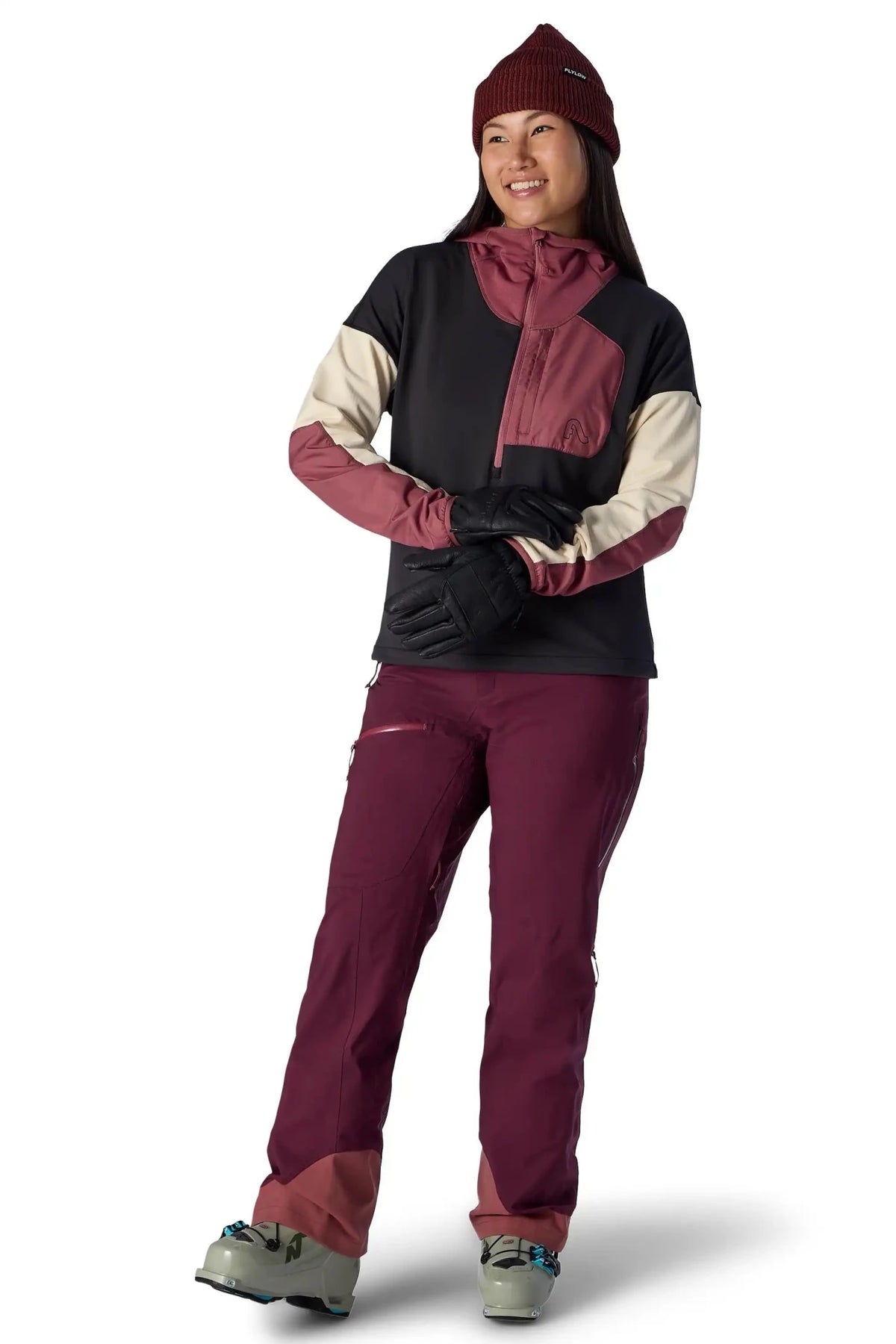 Women's colorblock pullover hoodie with half-zip, worn with ski pants and gloves on model