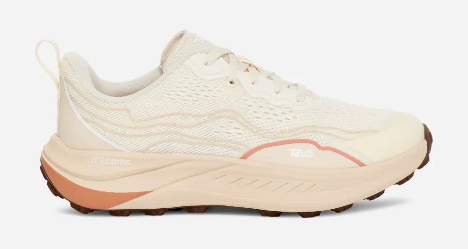Women's trail running shoe in birch and peach with mesh upper and thick textured sole