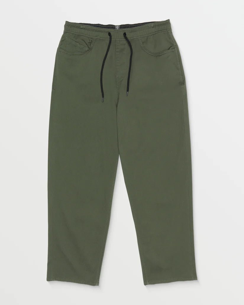 Loose fit green elastic waist pants with drawstring and front pockets on white background