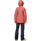 Norrona women's hooded Gore-Tex shell jacket shown from behind with dark pants