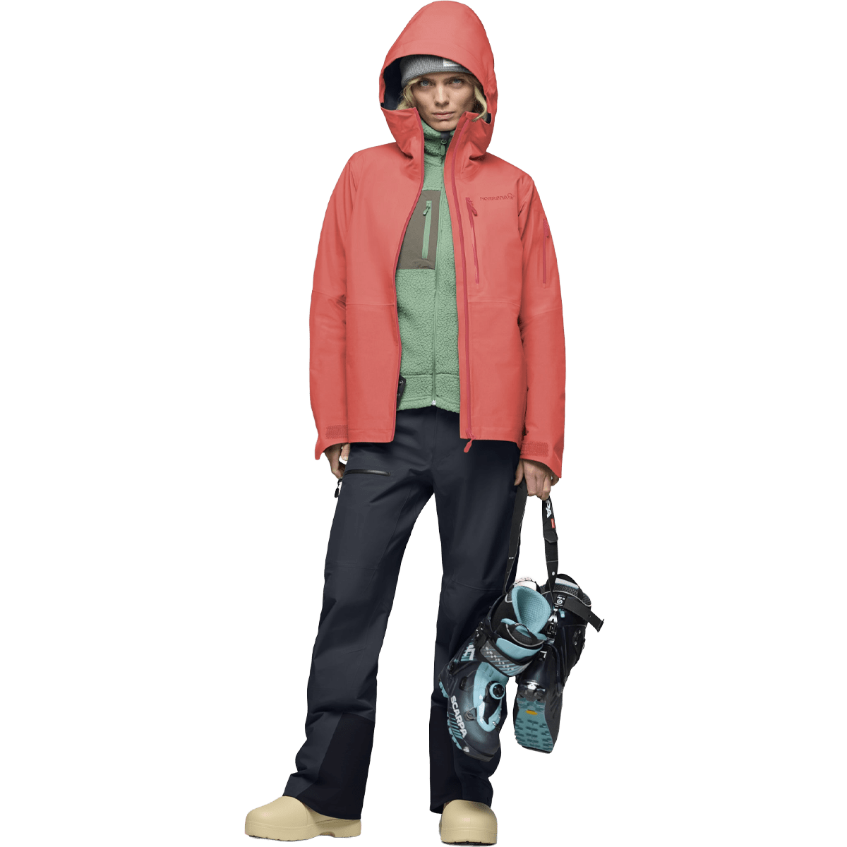 Women's hooded Gore-Tex ski jacket worn with black pants and ski boots on white background.