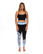 Black and blue floral print neoprene leggings with light blue waistband on female model