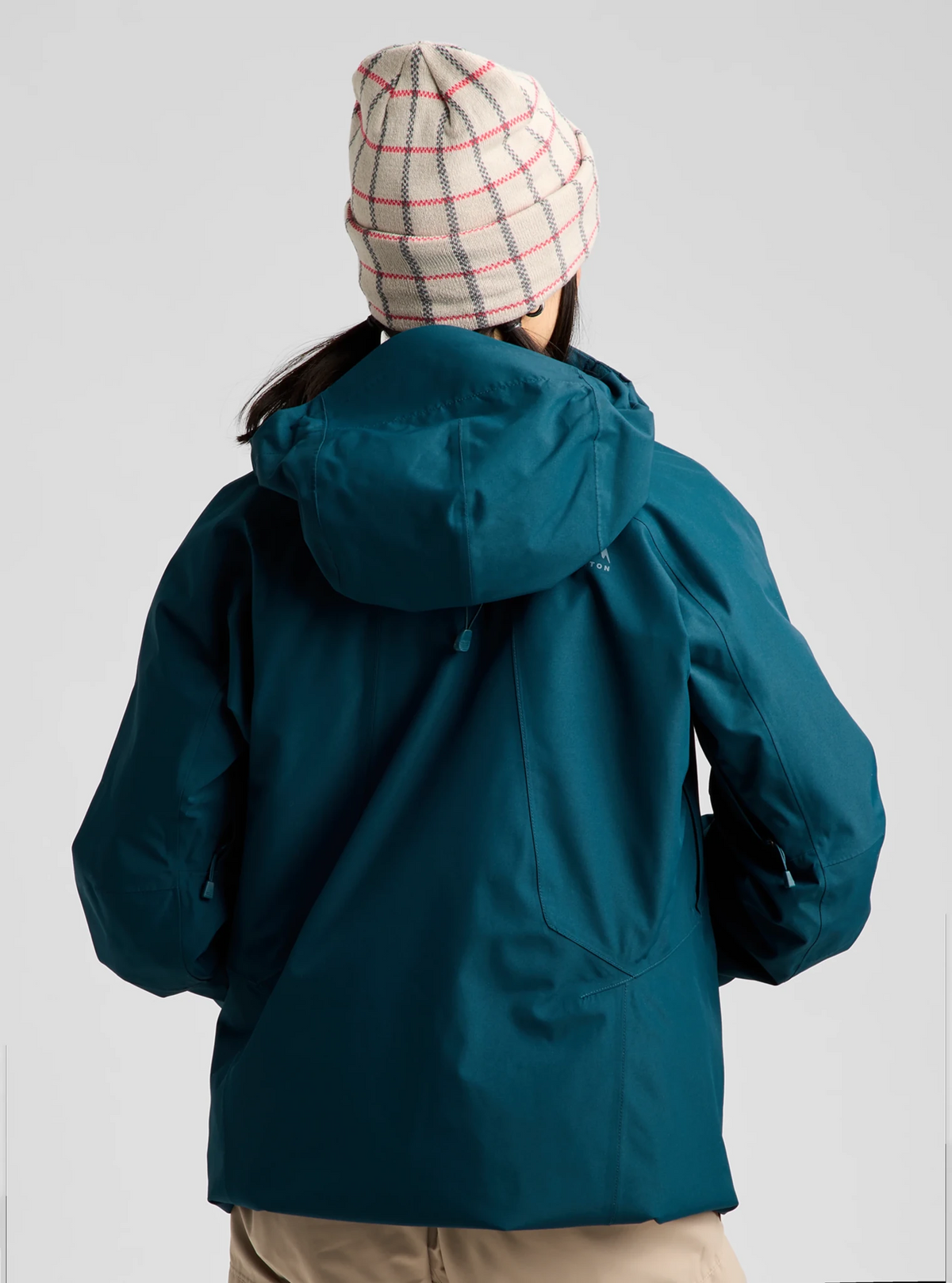 Burton women's 3-in-1 hooded jacket shown from the back with beanie hat