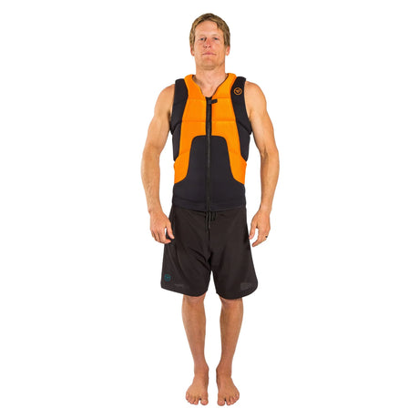 Man wearing an orange and black impact vest and black board shorts on a white background