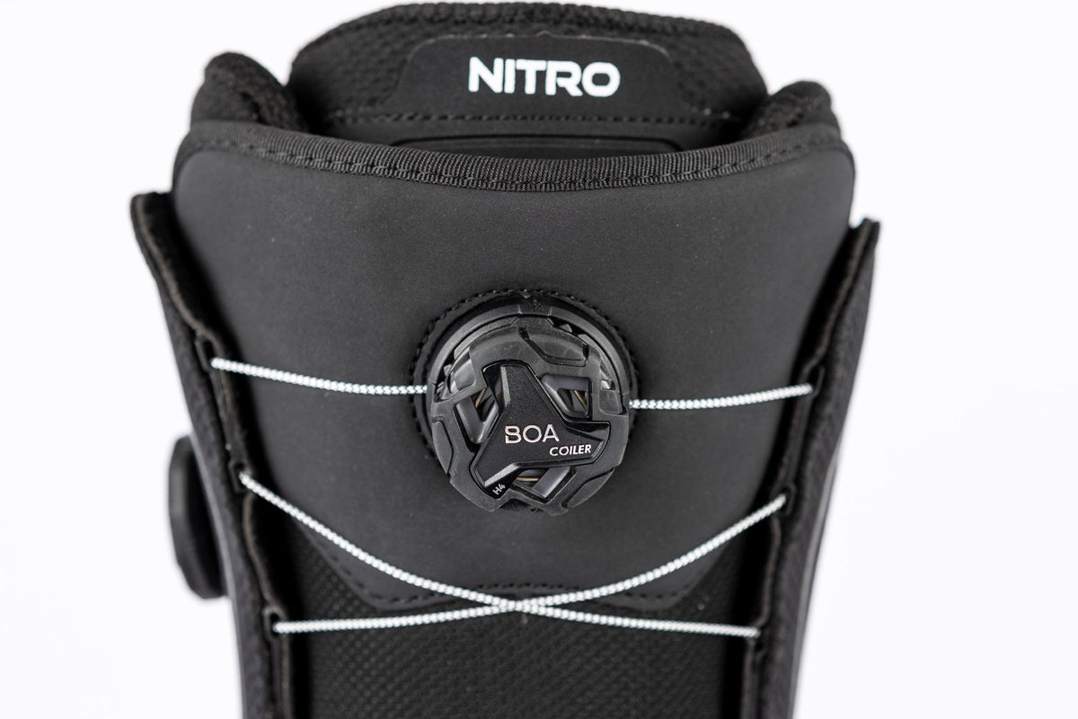 Nitro snowboard boot close-up showing BOA Coiler lacing system on upper cuff
