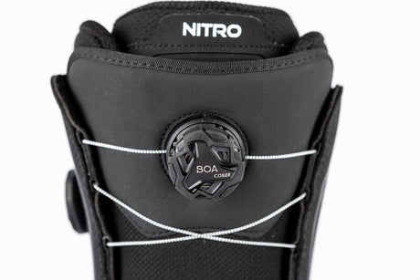 Nitro snowboard boot close-up showing BOA Coiler lacing system on upper cuff