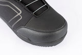 Close-up of a men's snowboard boot with BOA closure system and textured upper