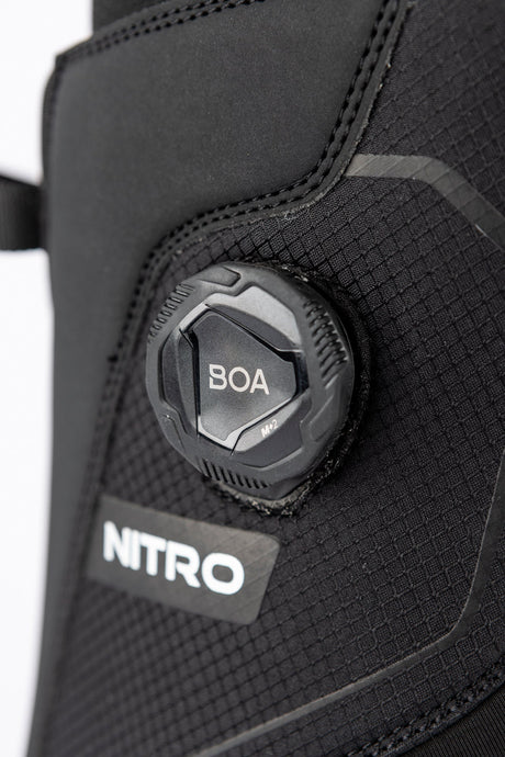 Close-up of Nitro snowboard boot featuring BOA M2 dial closure system on textured upper.
