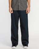 Volcom Billow Pant in navy blue, wide-leg relaxed fit, worn with sneakers
