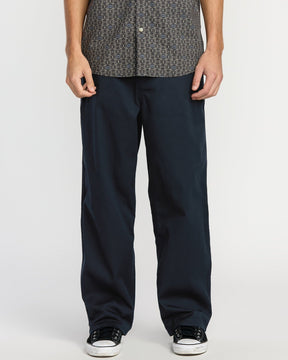 Volcom Billow Pant in navy blue, wide-leg relaxed fit, worn with sneakers