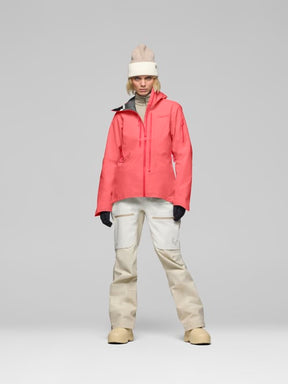 Women's coral pink Norrona Lofoten Gore-Tex insulated jacket with cream snow pants