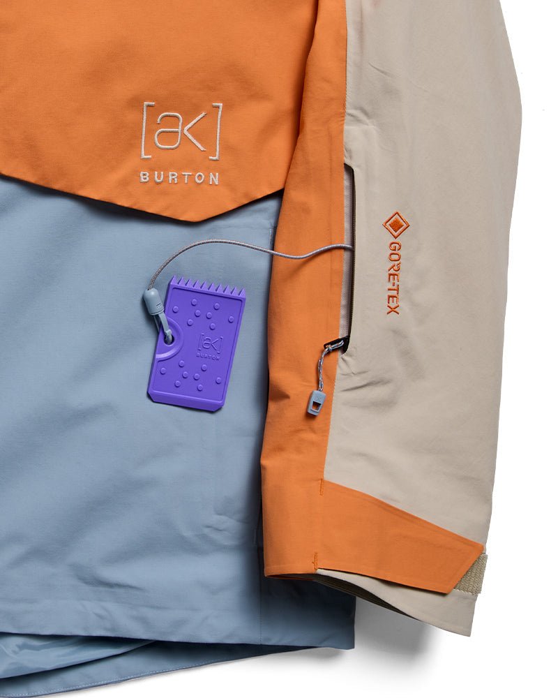 Burton AK Gore-Tex insulated jacket detail showing color-block panels and logo tag