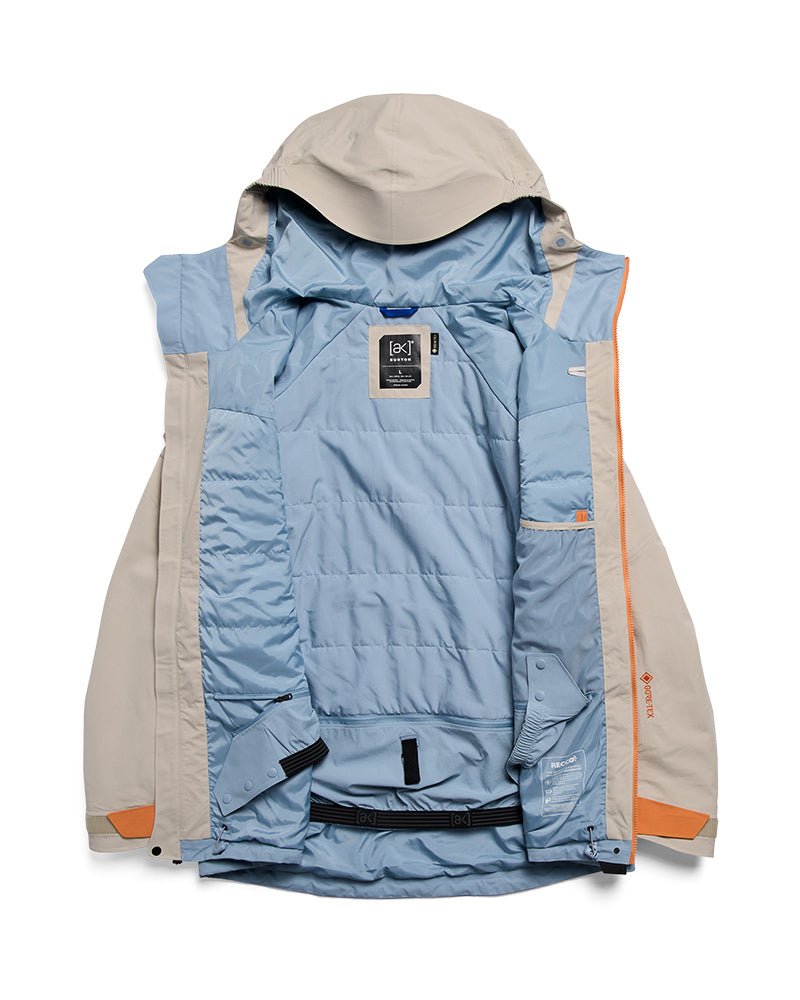 Burton AK Swash insulated Gore-Tex jacket shown open displaying quilted interior lining and multiple pockets