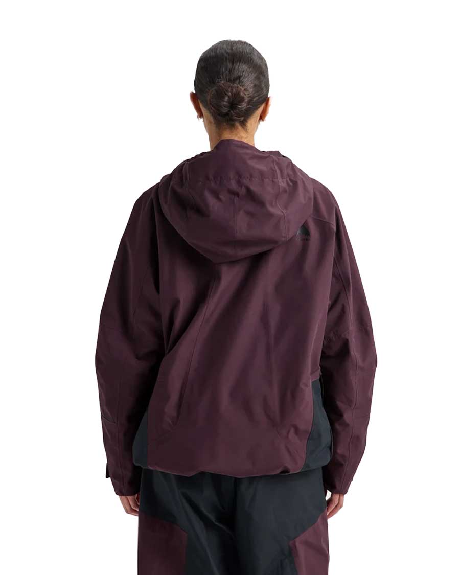 Women's relaxed fit pullover anorak with hood shown from the back on a model