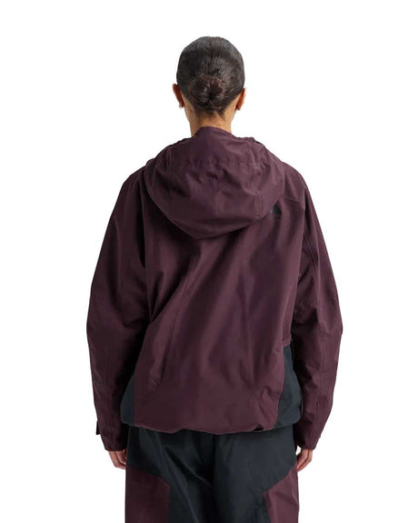 Women's relaxed fit pullover anorak with hood shown from the back on a model