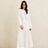 White open-knit long sleeve jumper with relaxed fit and ribbed cuffs