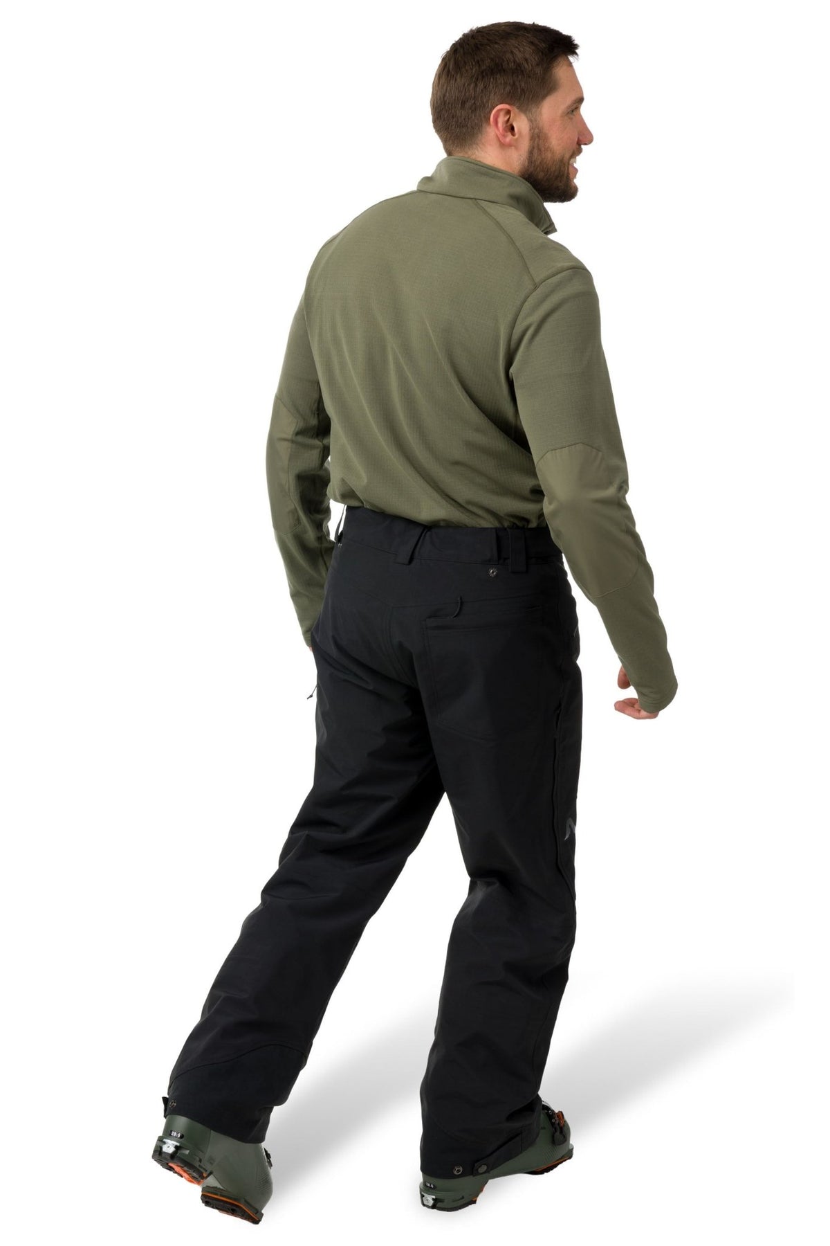 Men's technical ski pants with articulated fit, cargo pockets, and ski boot gaiters