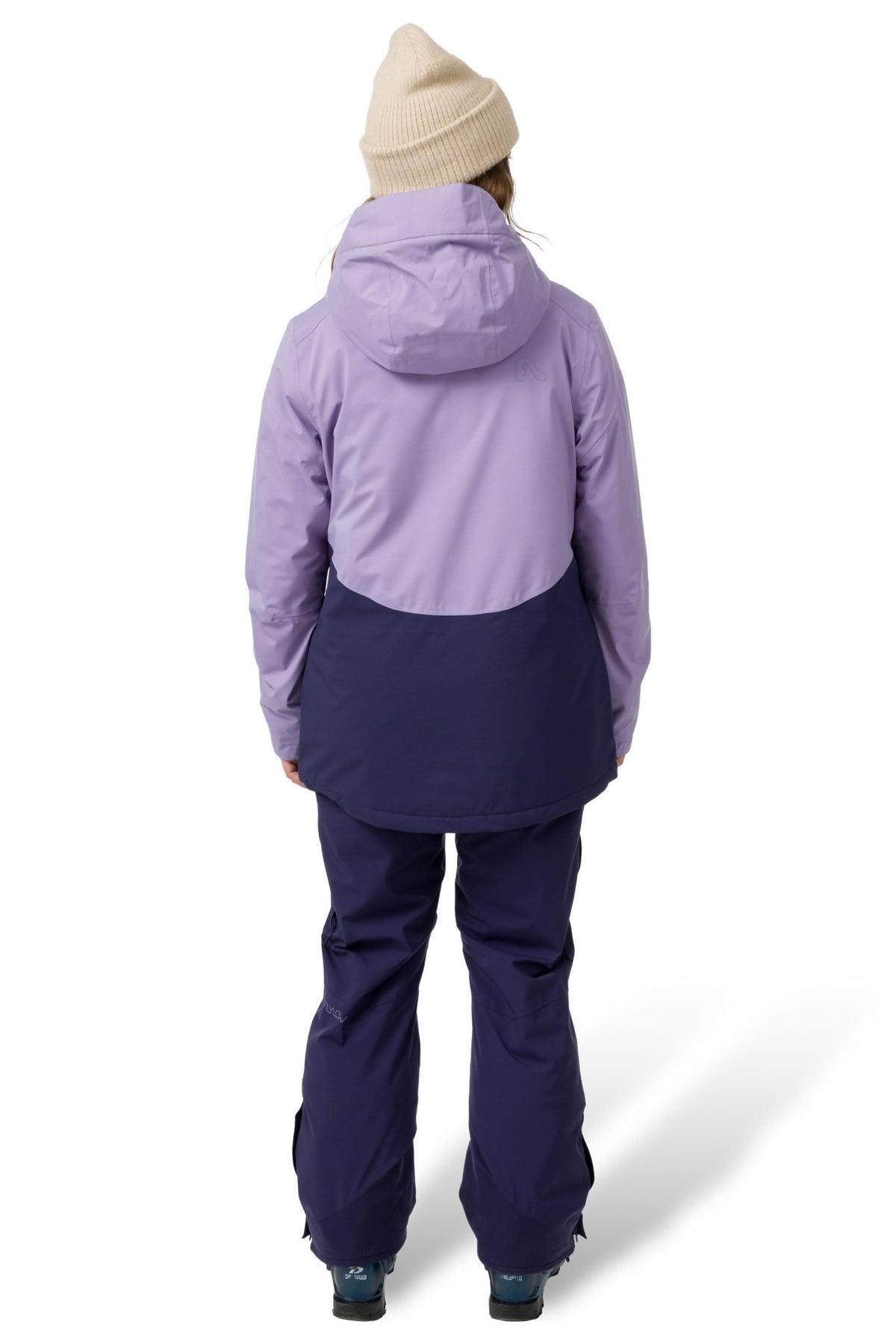 Women's two-tone ski jacket with hood shown from back, paired with matching snow pants