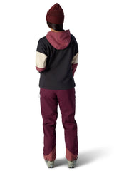 Women's colorblock pullover hoodie with hood, shown from behind on a model with ski pants