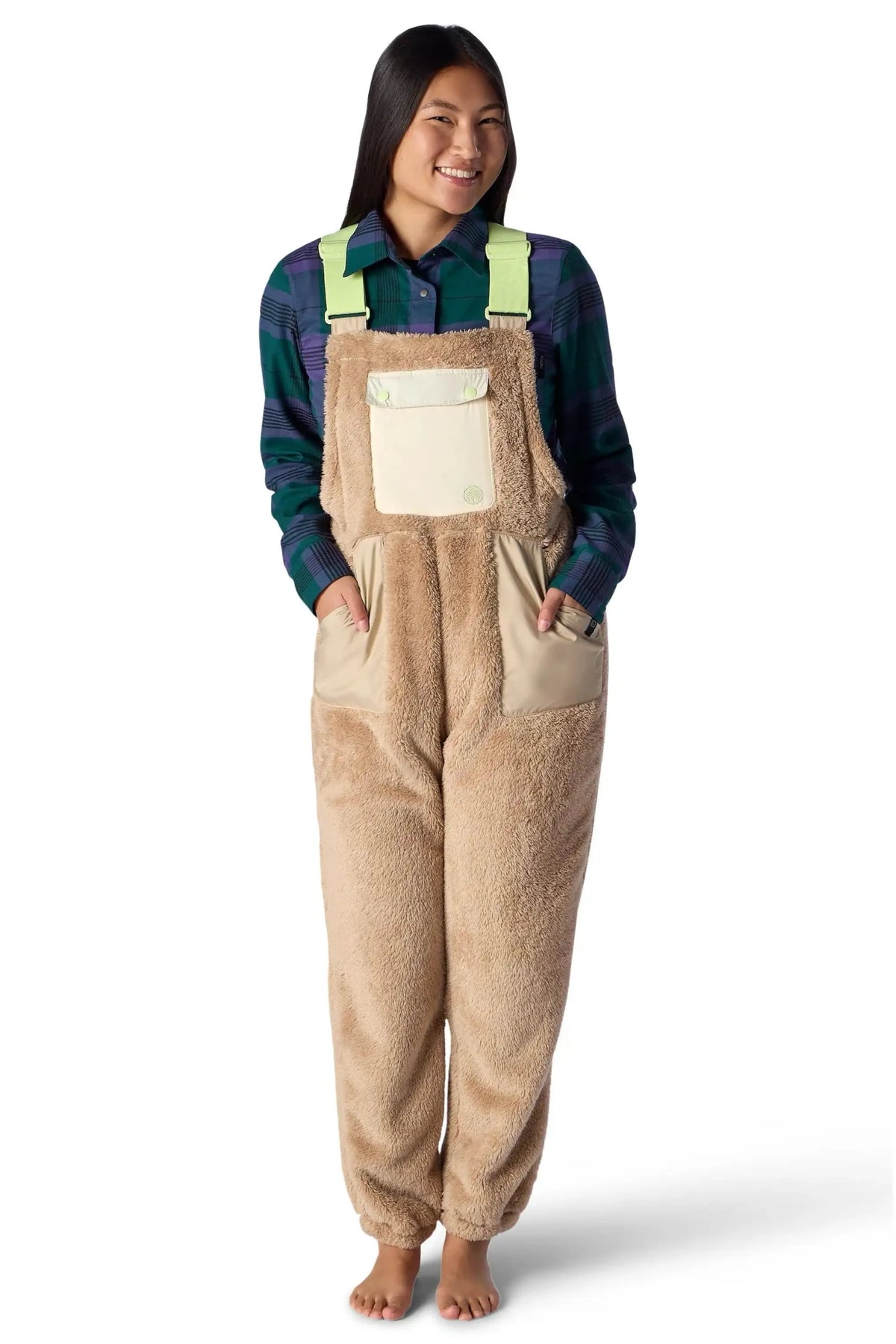 Women's sherpa fleece bib overalls with bright green straps and contrast chest pocket