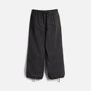 Wide-leg parachute pants with drawstring waist and ankle closures, orange contrast stitching details