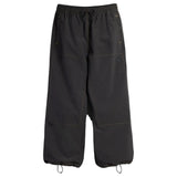 Wide-leg drawstring pants with contrast stitching, cargo pockets, and ankle cinch cords.
