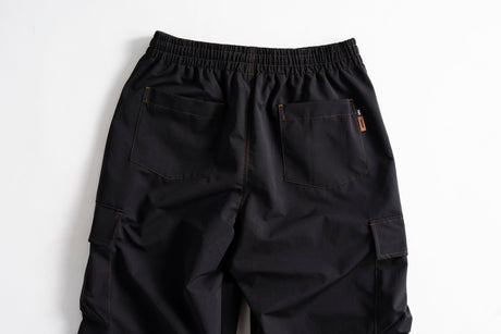 Men's cargo pants with elastic waistband, back pockets, and side cargo pockets