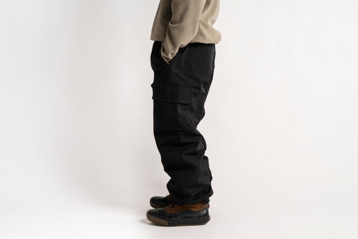 Men's relaxed fit cargo pants with side pockets, paired with casual boots