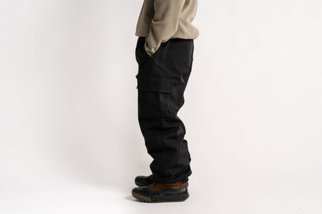 Men's relaxed fit cargo pants with side pockets, paired with casual boots