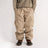 Baggy fit men's cargo pants with side pockets and elastic waistband, worn with boots.