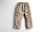 Men's cargo pants with elastic waistband, side cargo pockets, and relaxed fit shown from back