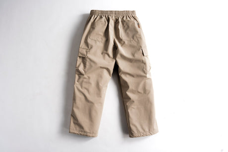 Men's cargo pants with elastic waistband, side cargo pockets, and relaxed fit shown from back