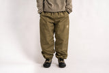 Relaxed fit men's snow pants with elastic waist, gathered ankles, and small logo patch