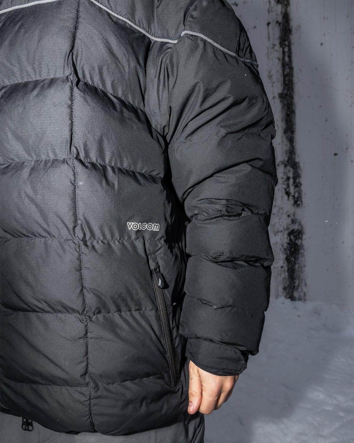 Volcom men's quilted puffer jacket with zippered side pocket and puffy insulated sleeves