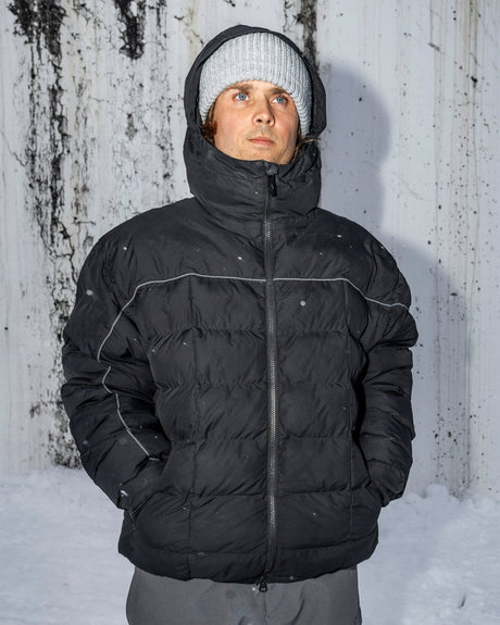 Men's insulated puffer jacket with hood, reflective piping, and front zip closure