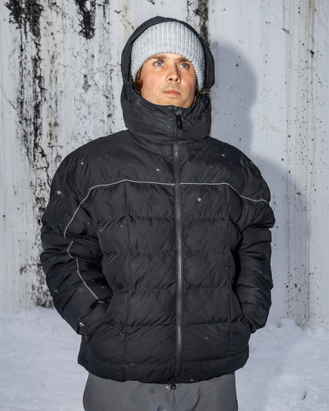 Men's insulated puffer jacket with hood, reflective piping, and front zip closure