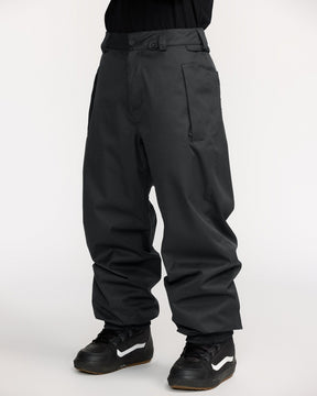 Volcom men's black shell snow pants with relaxed fit and Vans snowboard boots