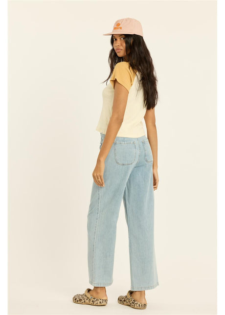 Women's short-sleeve colorblock knit crop top with contrast sleeves, shown from back