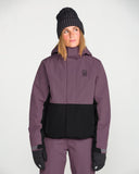 Volcom women's insulated snow jacket with two-tone colorblock design and hood, worn by model