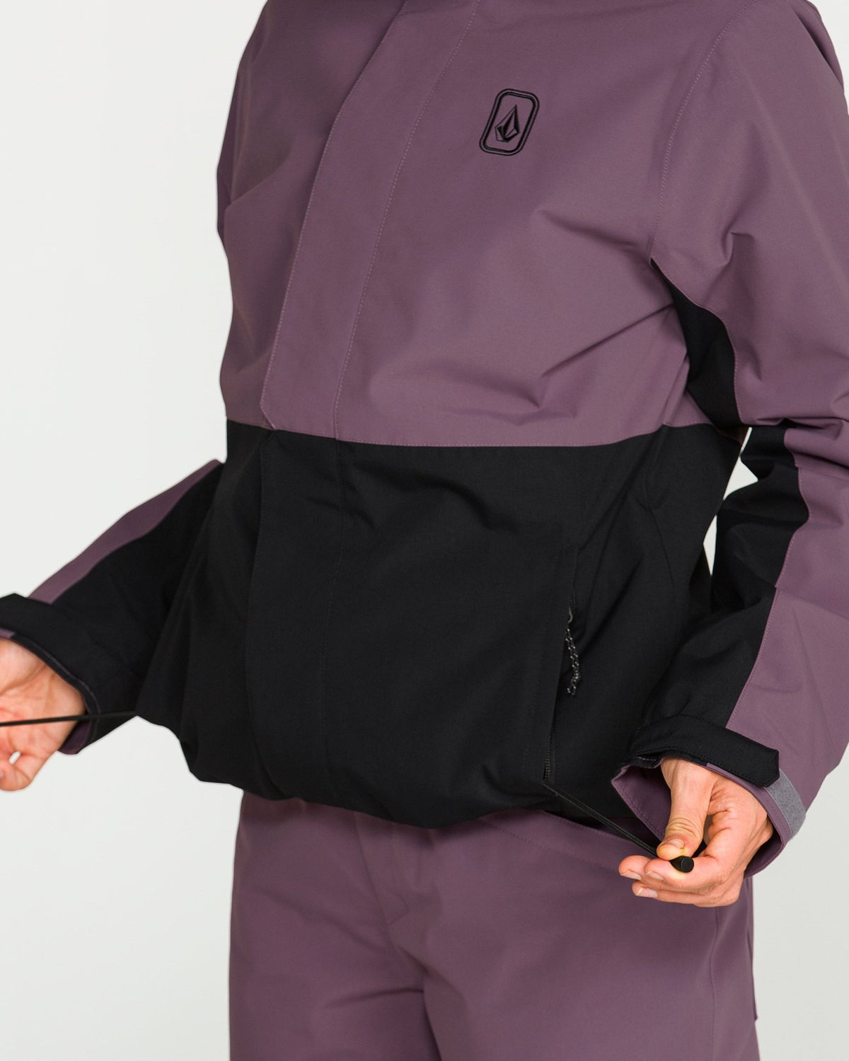 Volcom women's insulated snow jacket with color-block design and zipper detail shown open