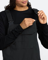 Volcom women's bib overalls with adjustable shoulder straps, chest pocket, and logo detail.