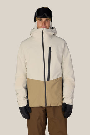Men's two-tone ski jacket with hood, chest zip pocket, worn with goggles and gloves.