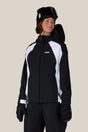 Women's fitted shell ski jacket with hood, gloves, and goggles on model