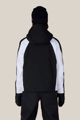Women's shell ski jacket with hood shown from the back on a model, featuring colorblock panels
