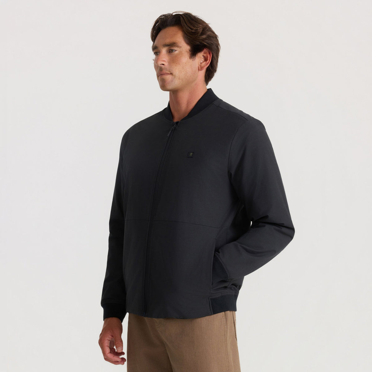 Men's bomber jacket with ribbed collar, cuffs, and hem, featuring a full zip closure.