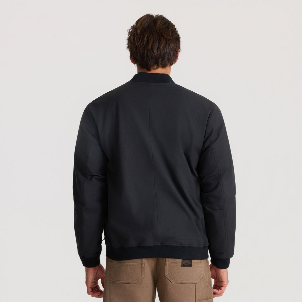 Men's bomber jacket with ribbed collar, cuffs, and hem shown from the back