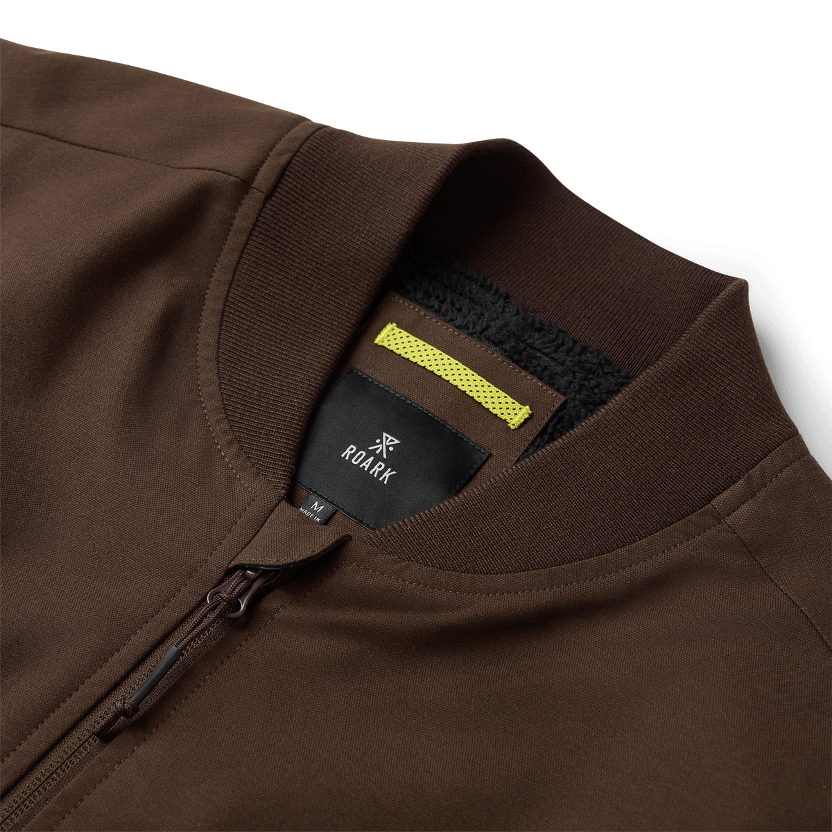 Roark bomber jacket with ribbed collar, front zipper, and fleece-lined interior detail