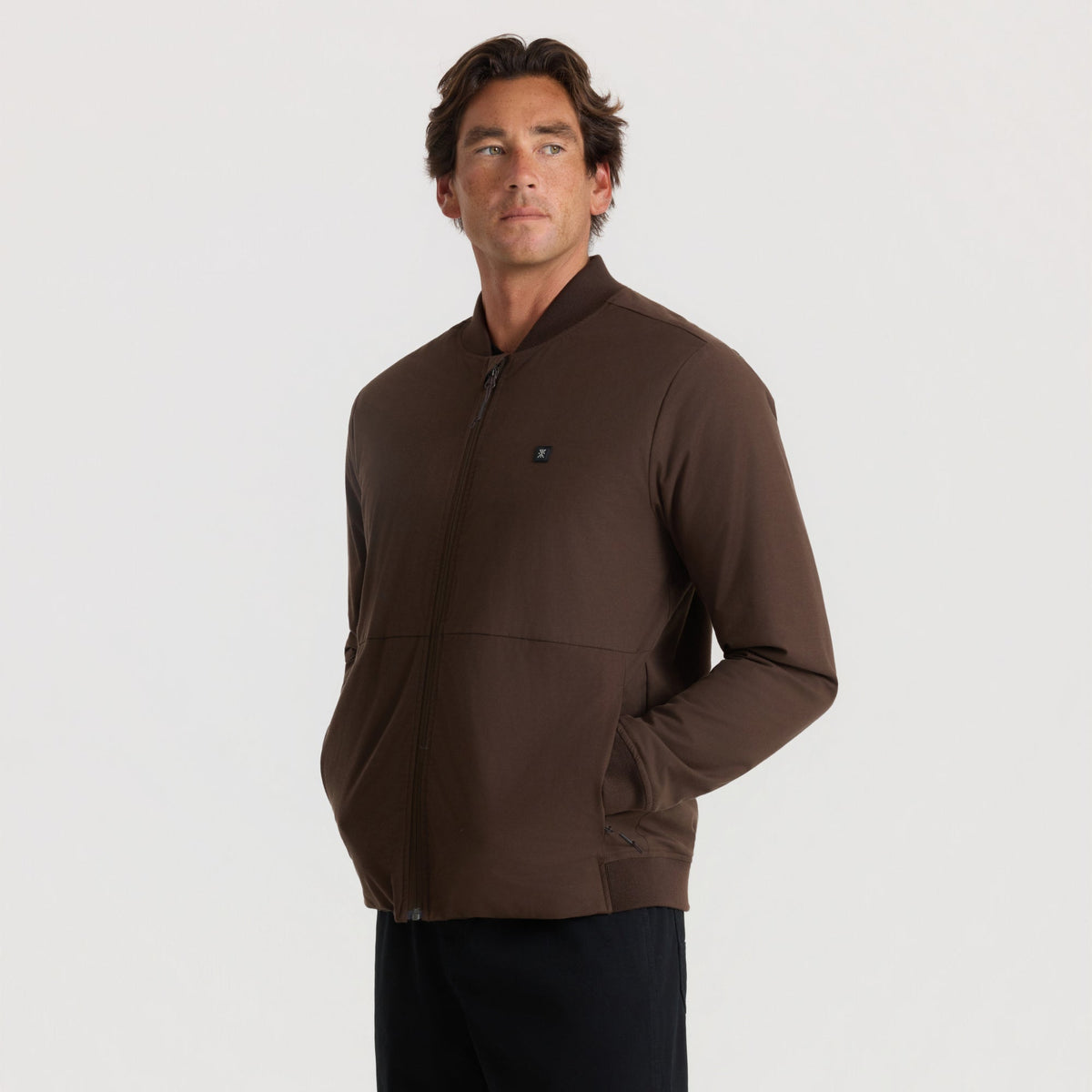 Men's zip-up bomber jacket with ribbed collar, cuffs, and side pockets on male model